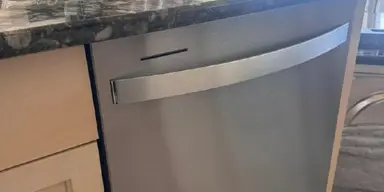 Real stainless-steel dishwasher serviced by Quality Repairs